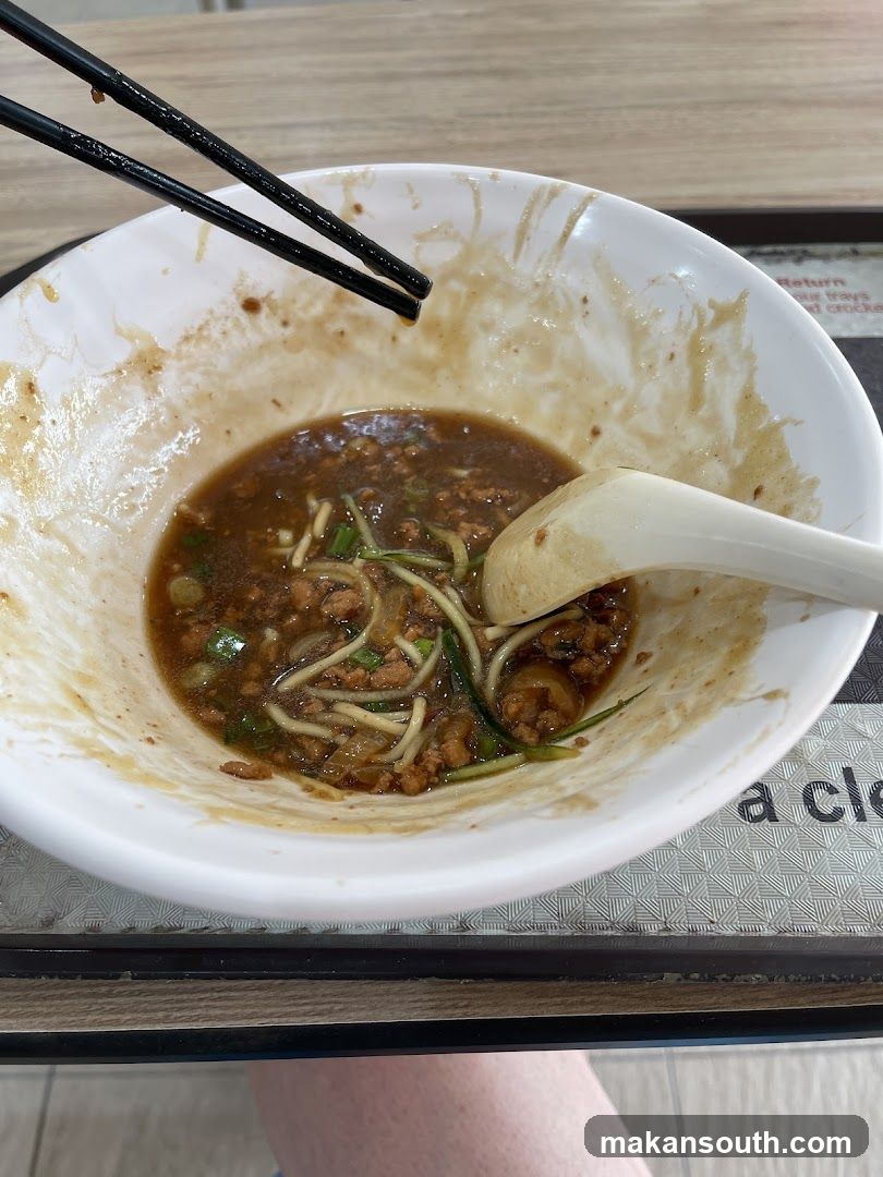 Bowl of Noodles with Chopsticks and Spoon