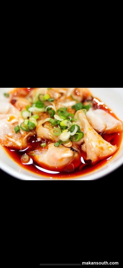 Dish with dumplings in spicy sauce