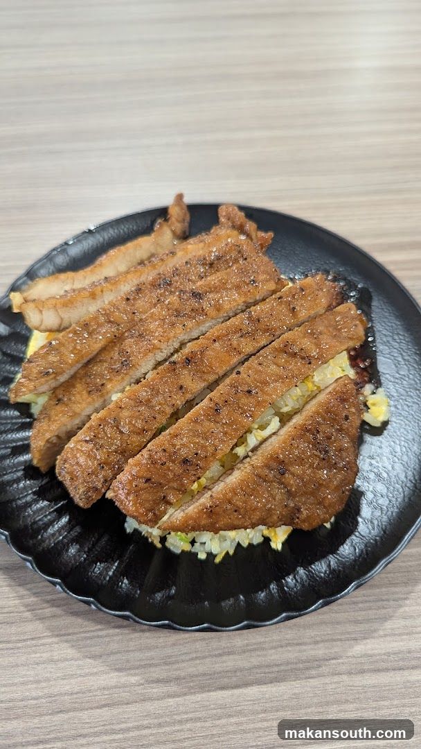 Sliced Fried Meat on Rice Bowl