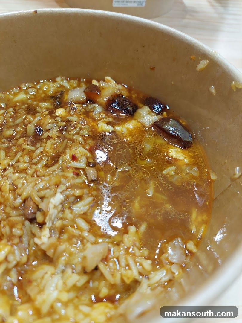 Bowl of Rice with Sauce and Dried Fruits
