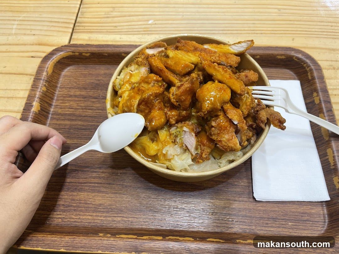 Chicken Rice Bowl with Chopsticks and Spoon