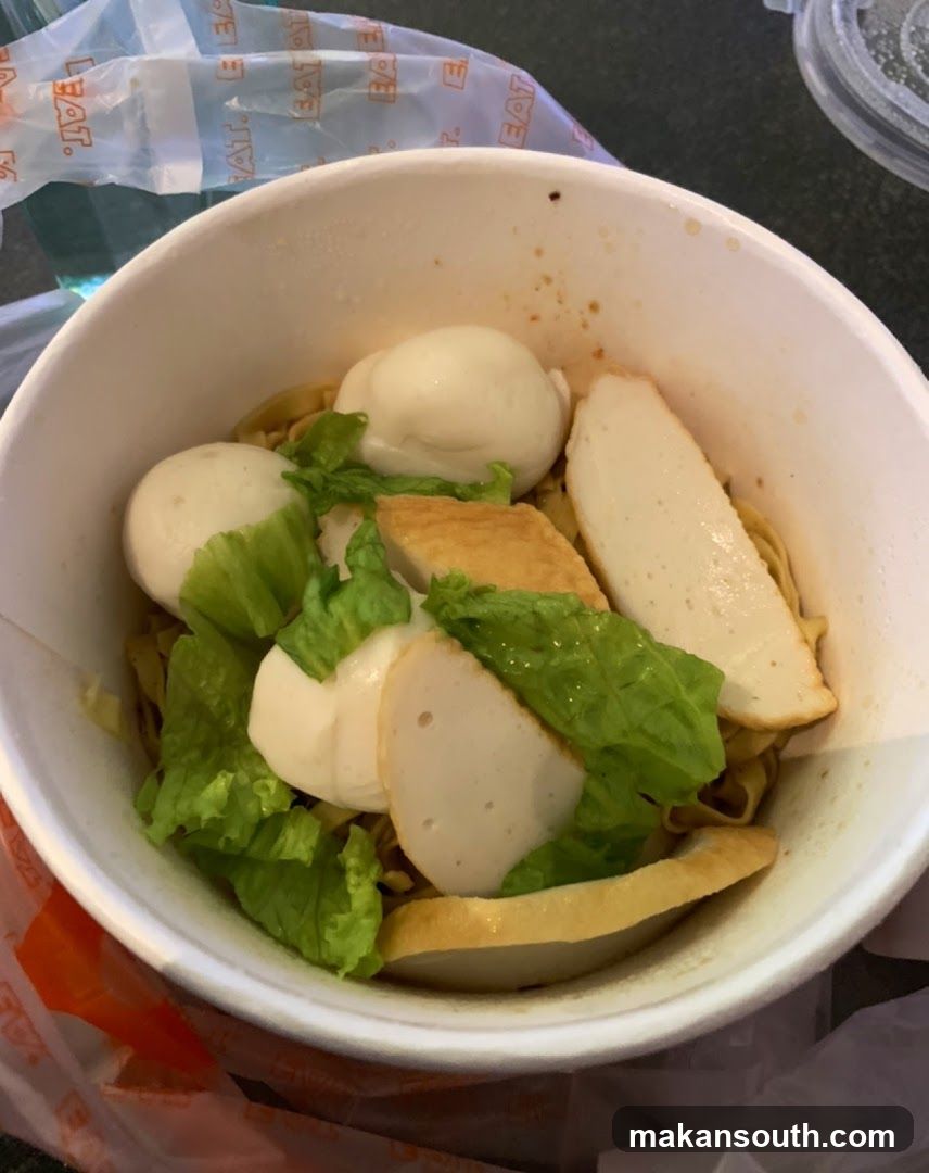 Noodle Bowl with Fish Balls and Lettuce