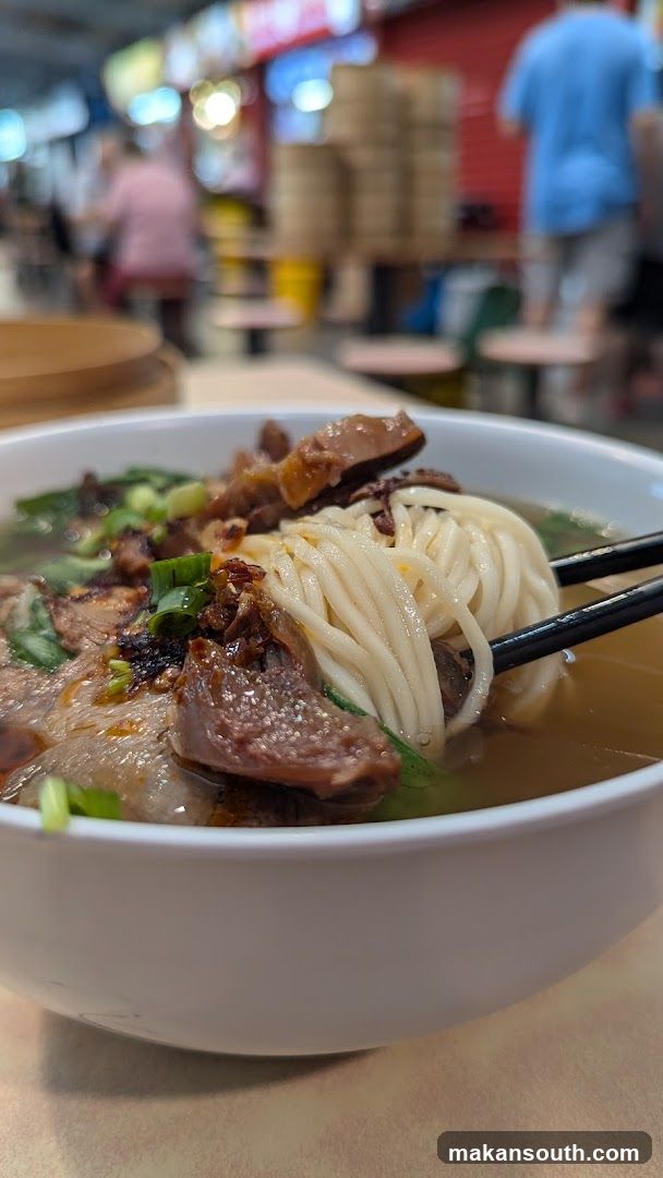 Bowl of Noodle Soup with Meat and Green Onions