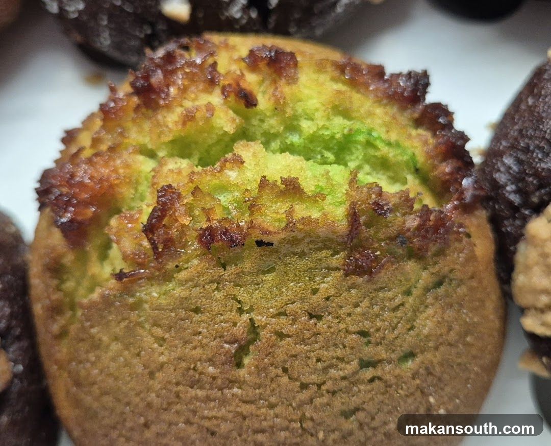Close-up of a baked pastry with green interior