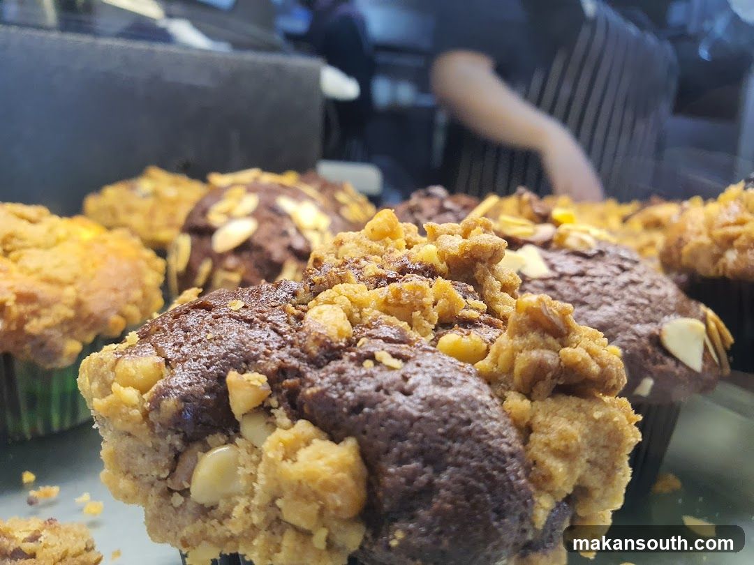 Muffins in a bakery display case