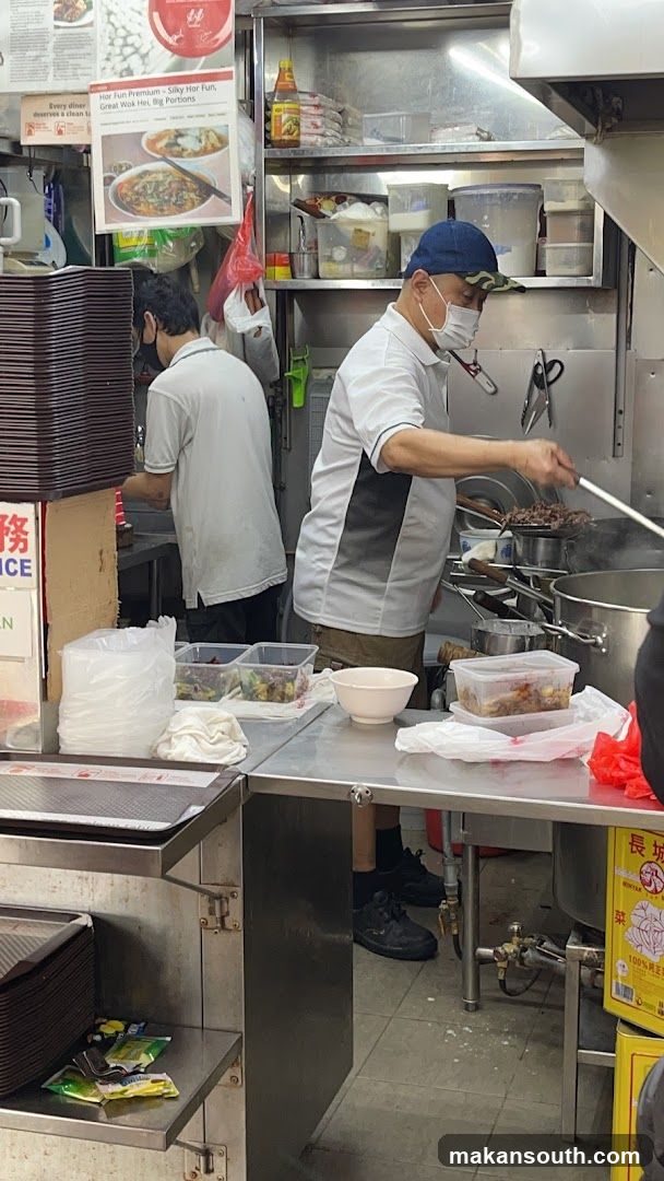 Kitchen Scene with Staff Cooking