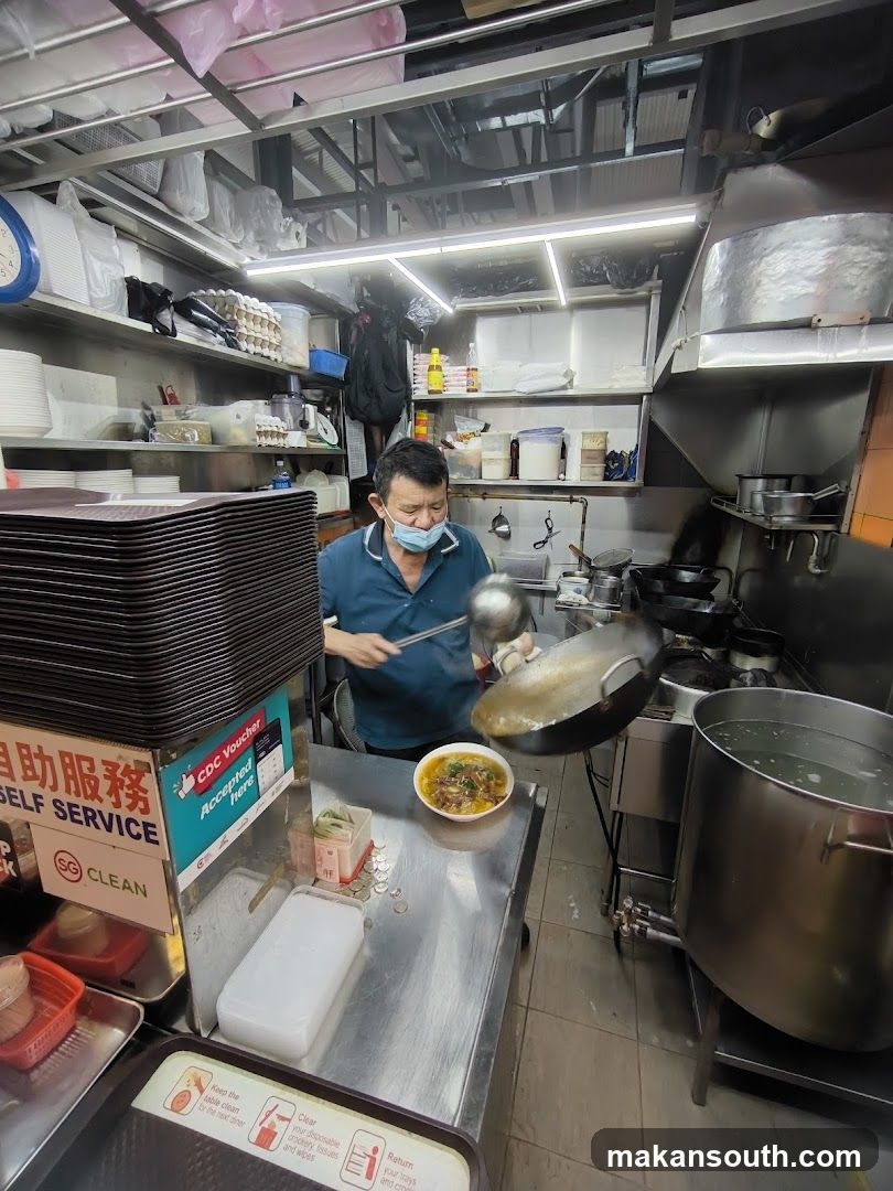 Kitchen Interior with Staff Cooking
