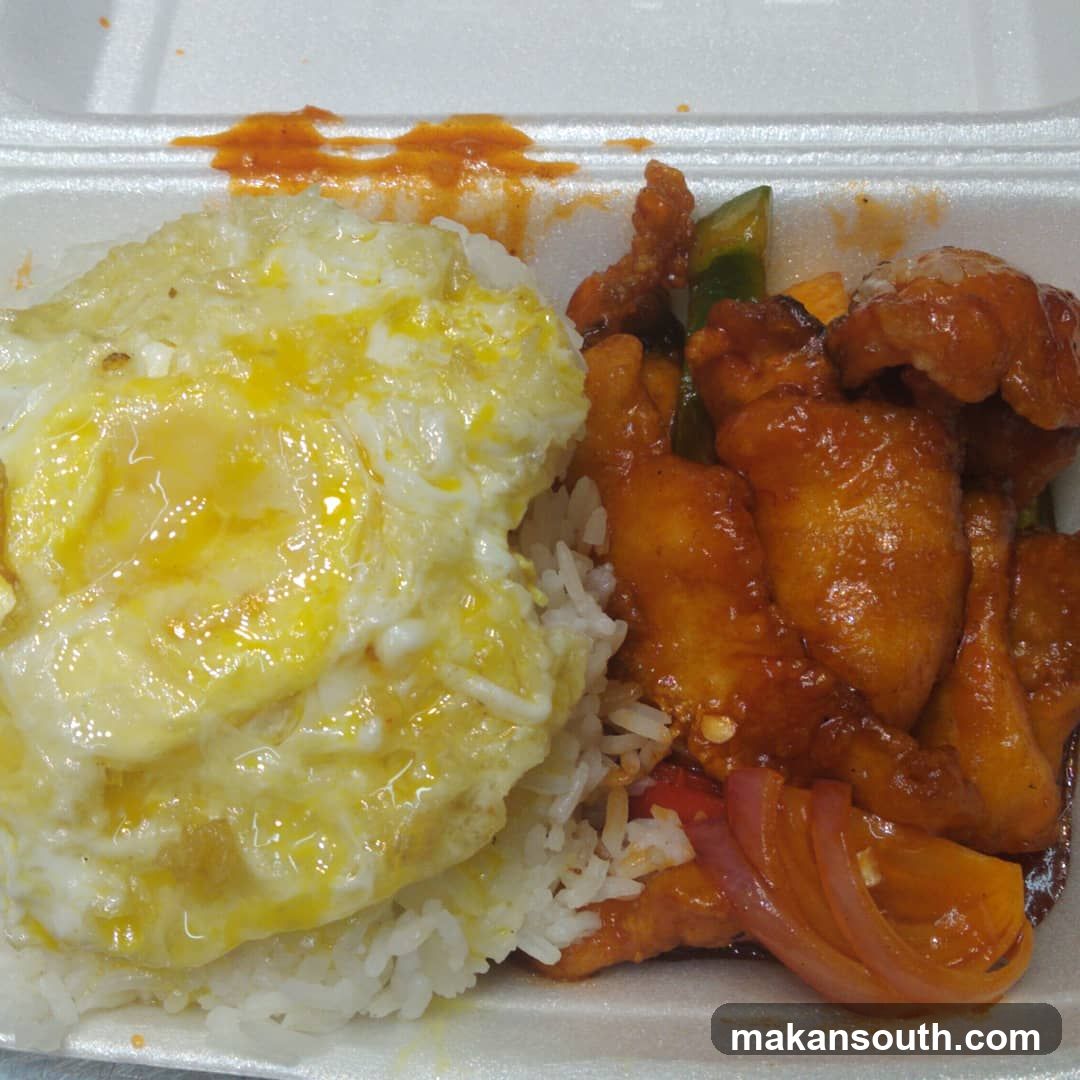 Takeout Meal with Fried Egg and Sweet and Sour Chicken