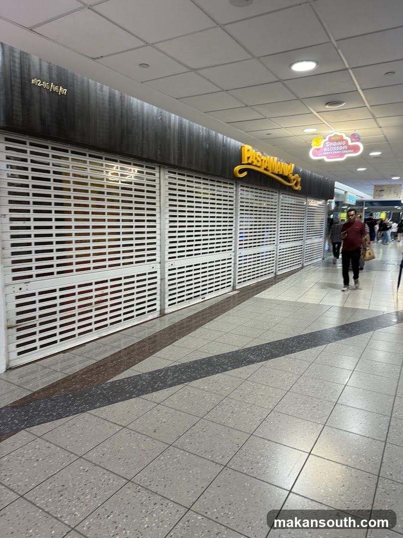Shopping Mall Corridor with Closed Storefronts