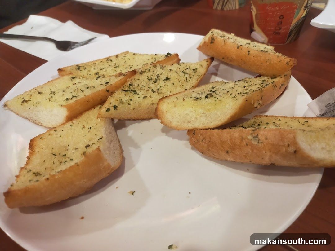 Garlic Bread Slices on a White Plate