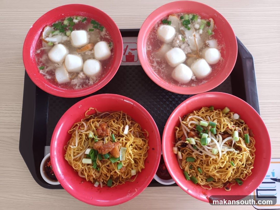 Four Bowls of Noodles and Soup on a Tray