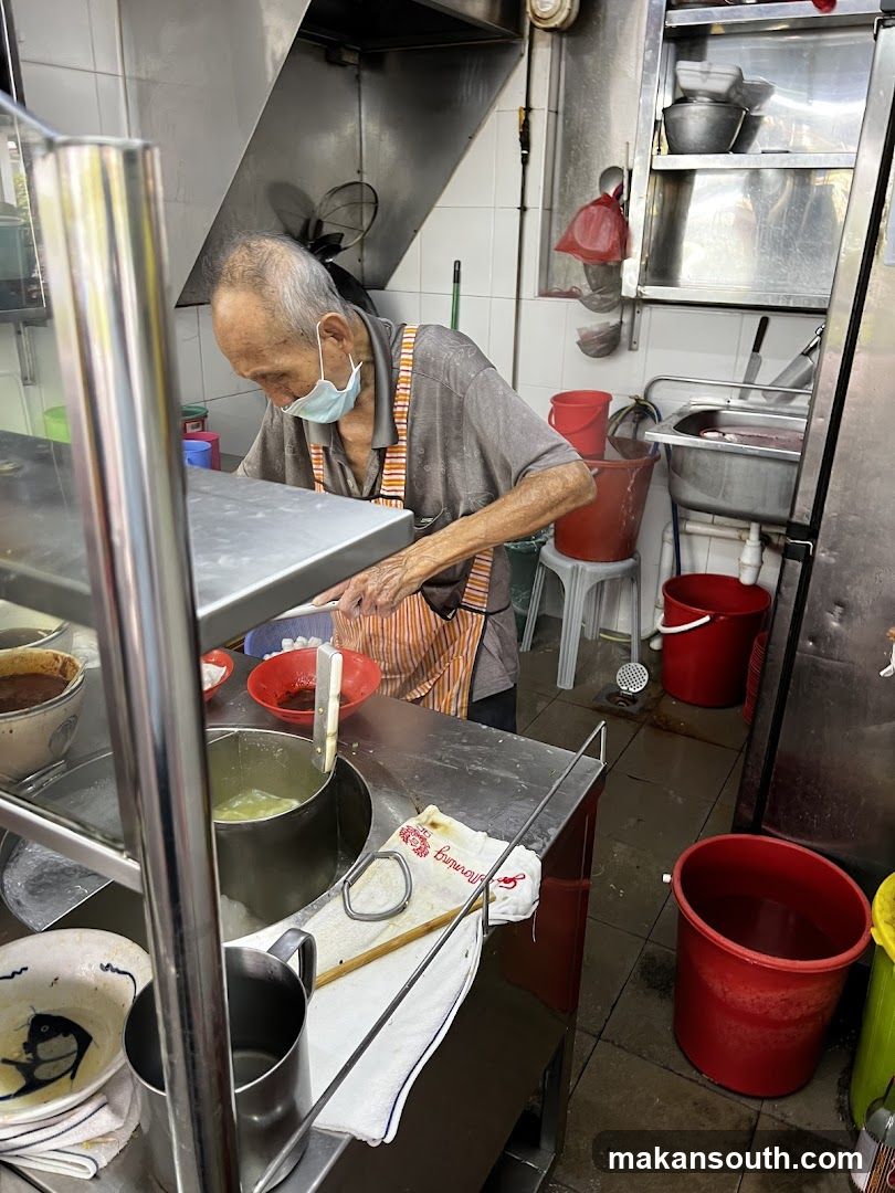 Kitchen Interior with Elderly Chef