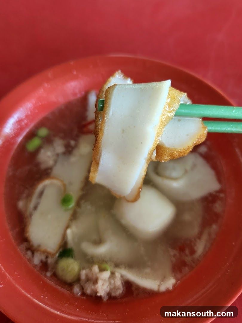 Bowl of Soup with Fried Dough and Tofu