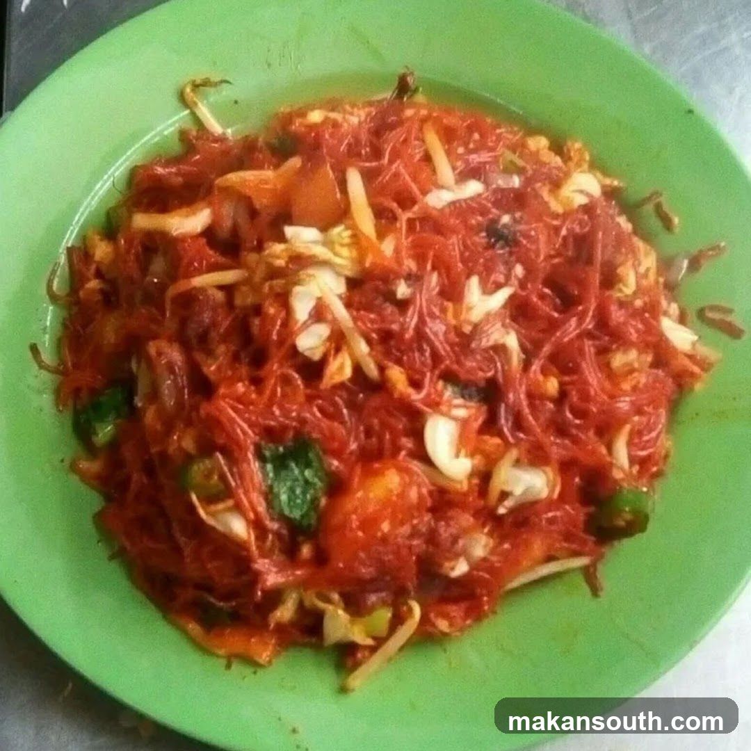 Spicy Noodle Dish on Green Plate