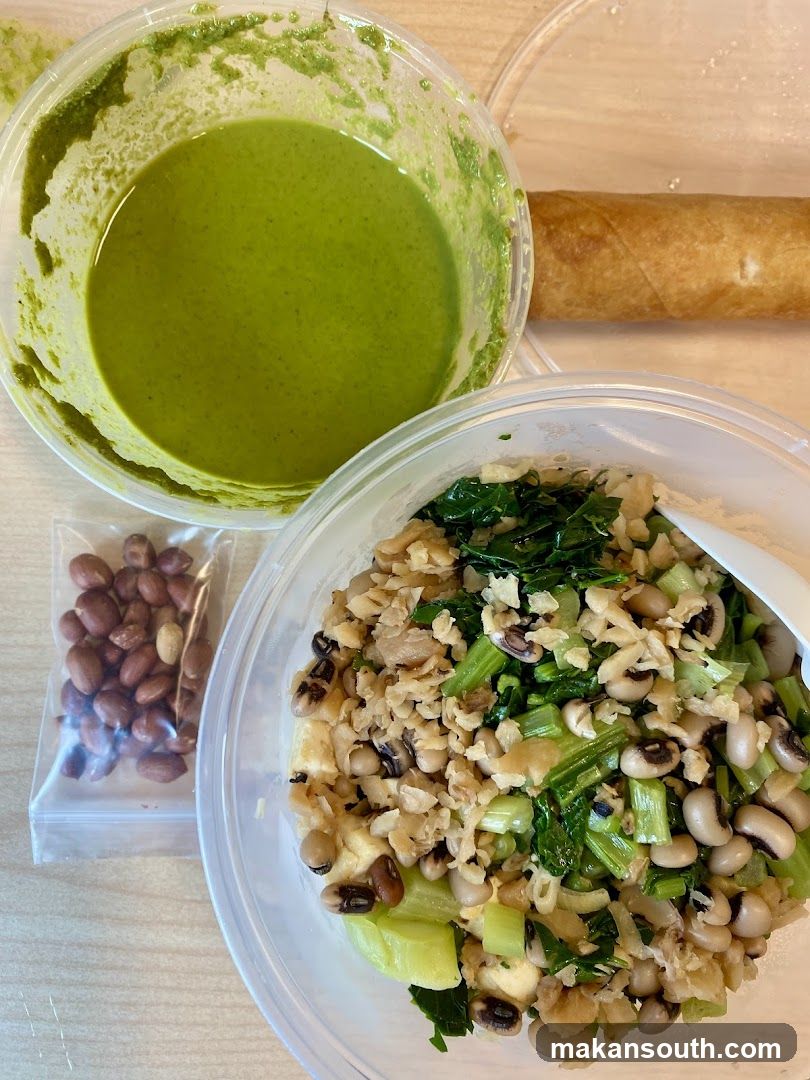Meal Containers with Green Sauce and Salad