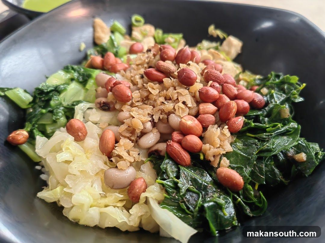 Bowl of stir-fried vegetables with peanuts and garlic