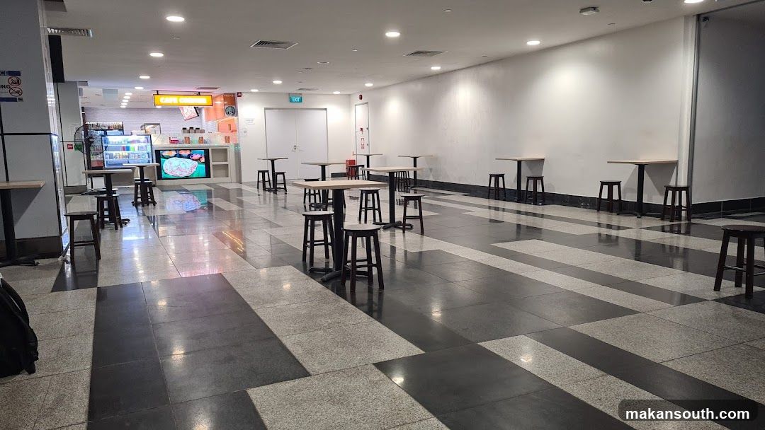 Empty Dining Area with Food Stall