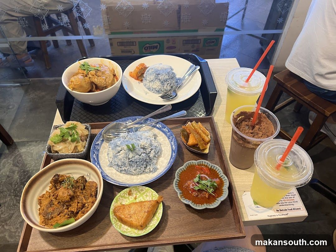 Food Spread with Blue Rice and Drinks