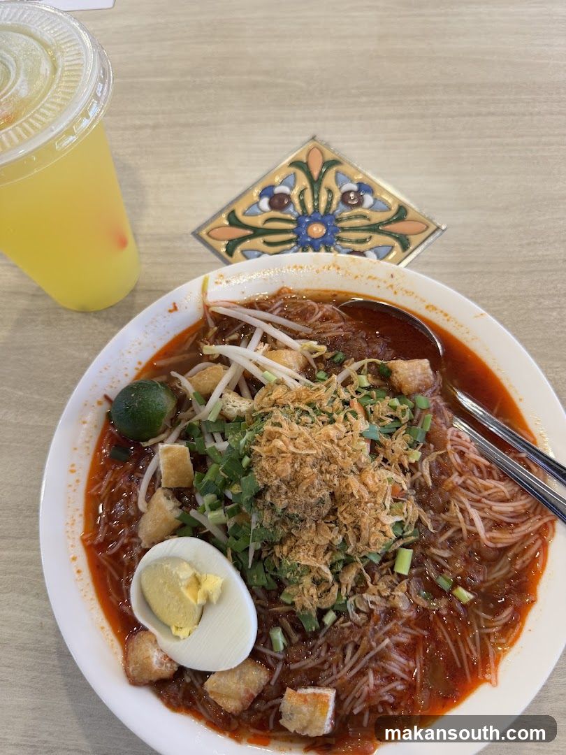 Spicy Noodle Dish with Side Drink
