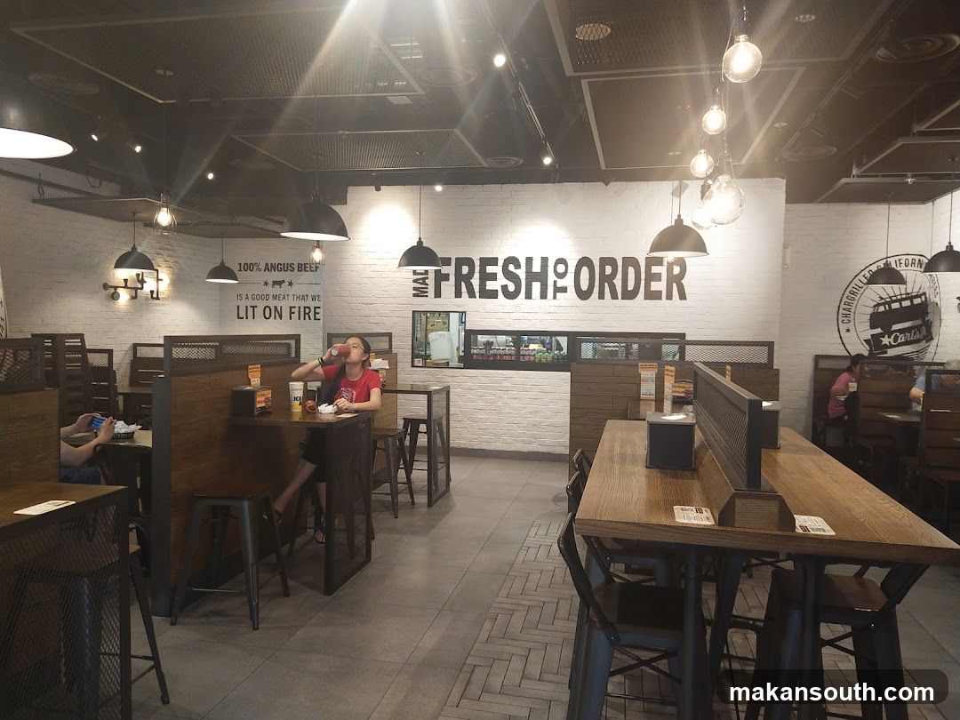 Restaurant Interior with 'Fresh to Order' Signage