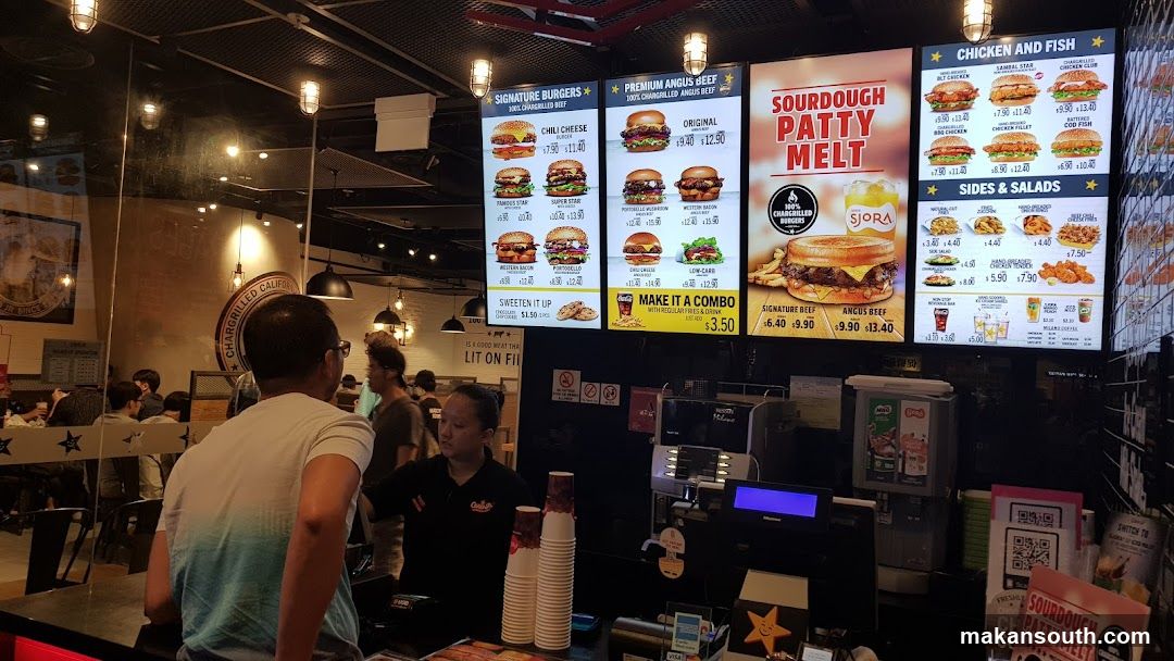 Restaurant Interior with Menu Boards and Staff