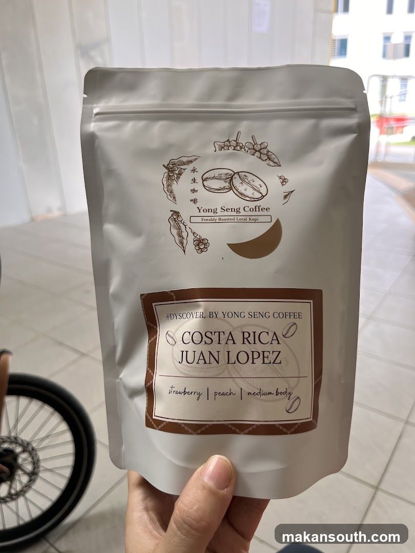 Hand holding coffee bag