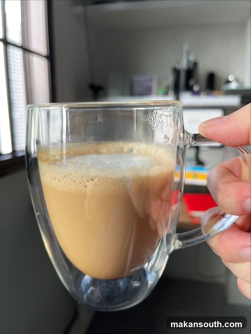 Hand holding coffee mug