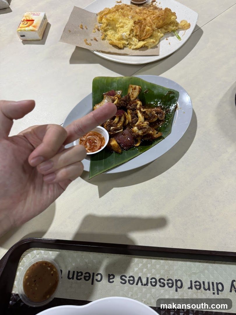 Food on a table with hand gesture