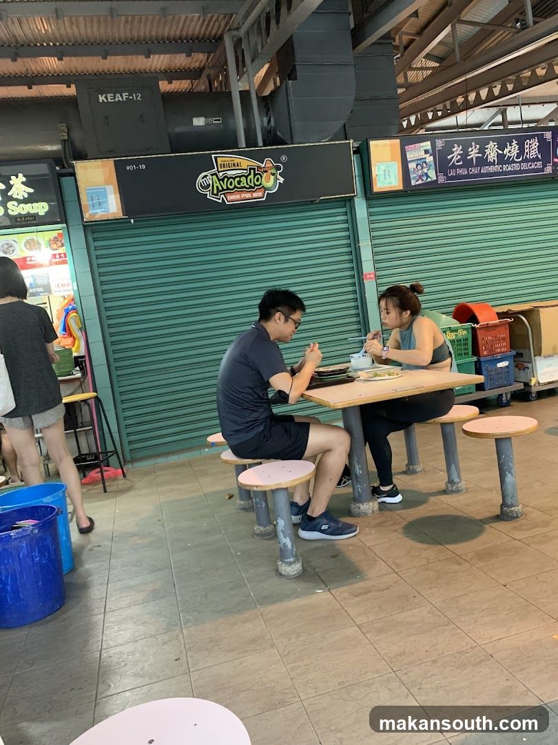 Diners at a food court stall