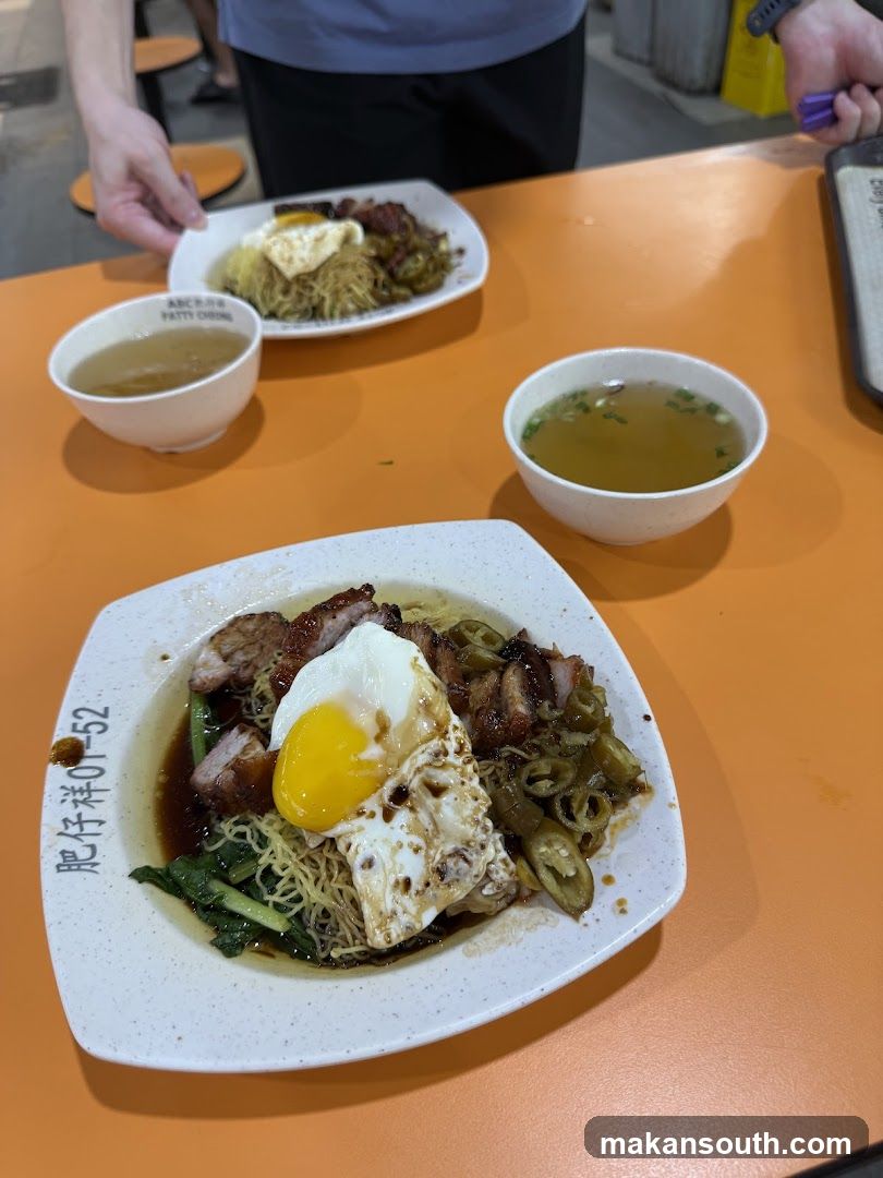 Noodle Dish with Fried Egg and Pork