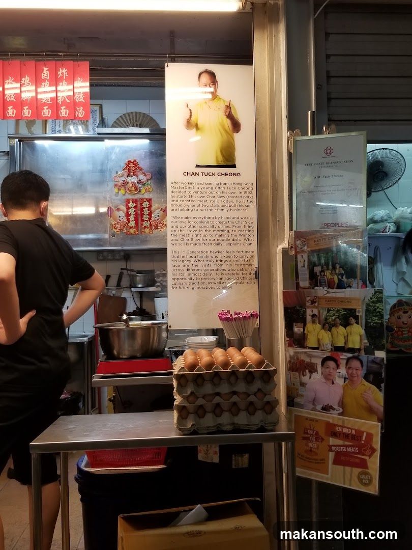 Food Stall Interior with Staff and Posters