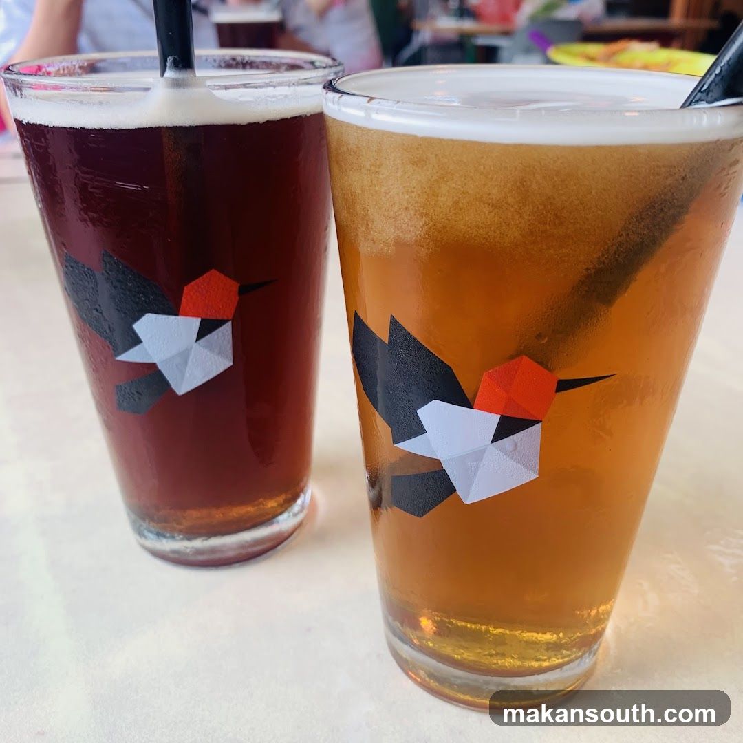 Two glasses of beer with origami bird design