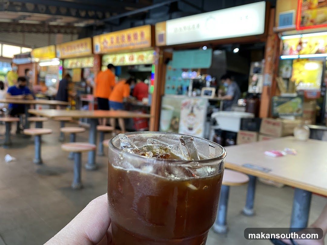 Food Court Interior with Iced Drink in Foreground