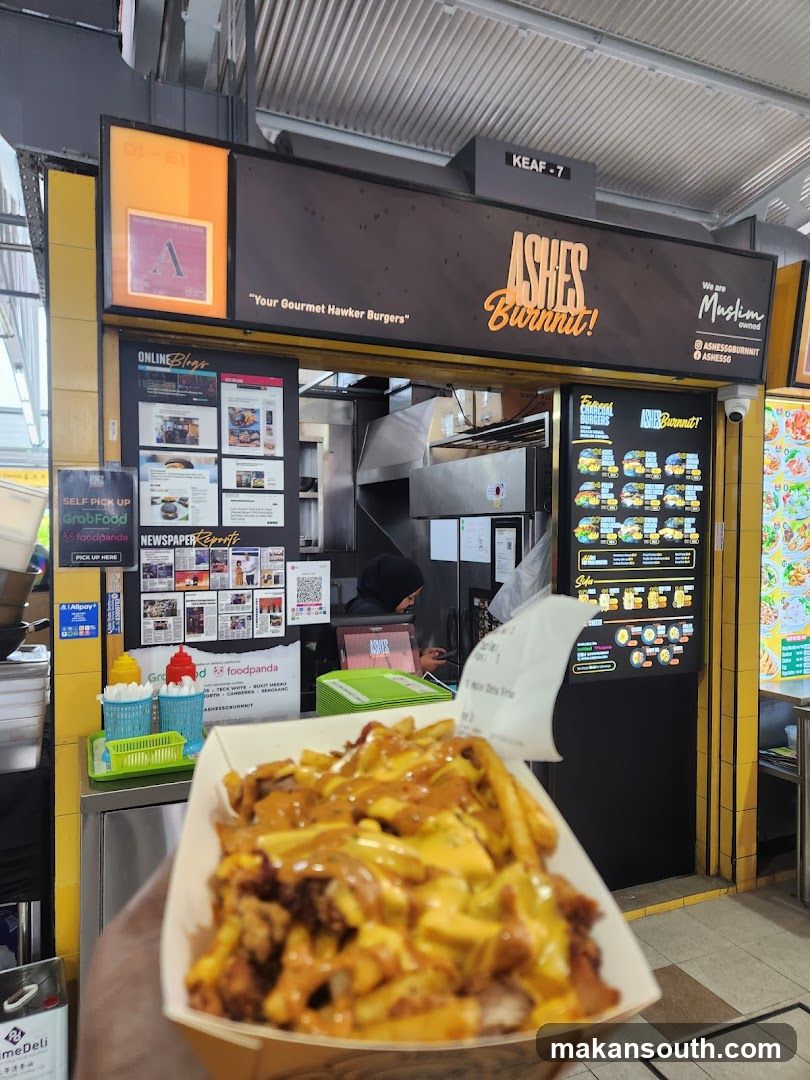 Food stall with poutine in foreground