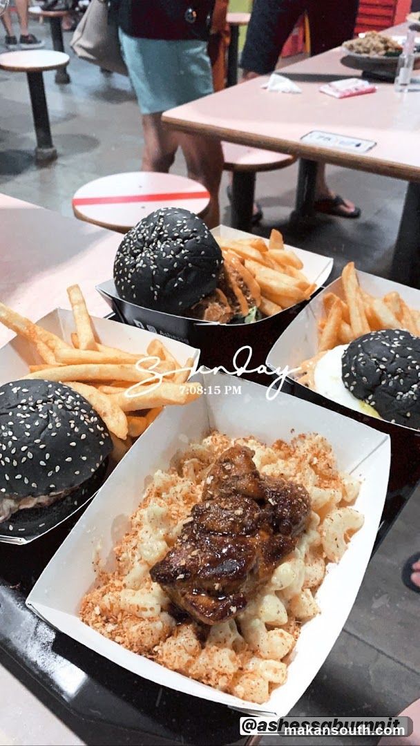 Food Spread with Black Burgers and Mac & Cheese