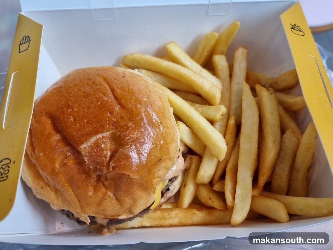 Burger and Fries in Takeout Box