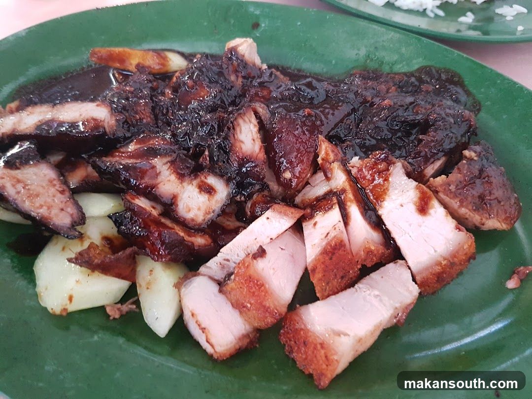 Sliced Roasted Pork with Sauce and Cucumber
