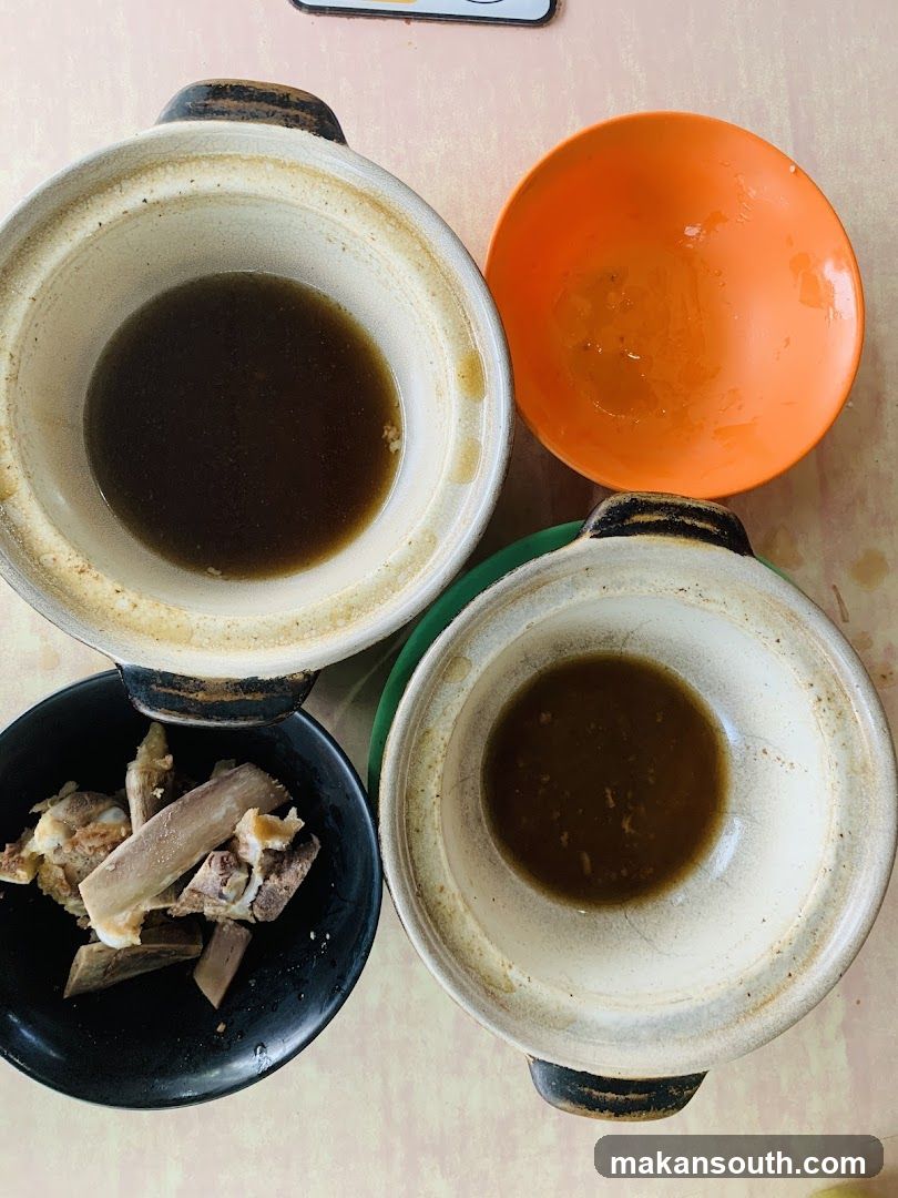 Empty Clay Pots with Soup and Bone