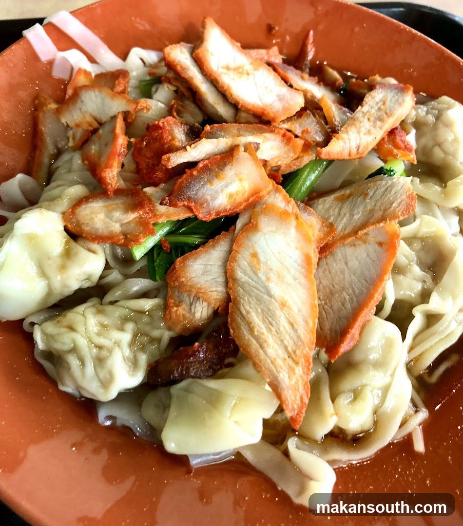Bowl of noodles with pork and wontons