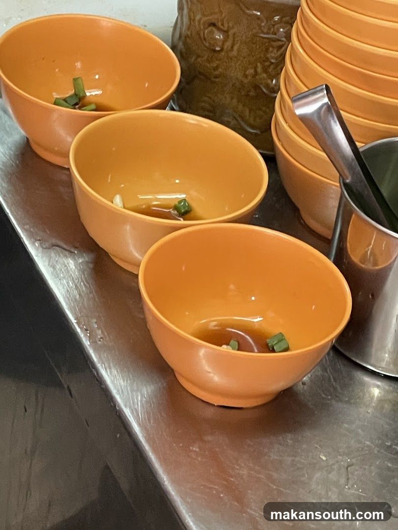 Orange Bowls with Sauce and Green Onions