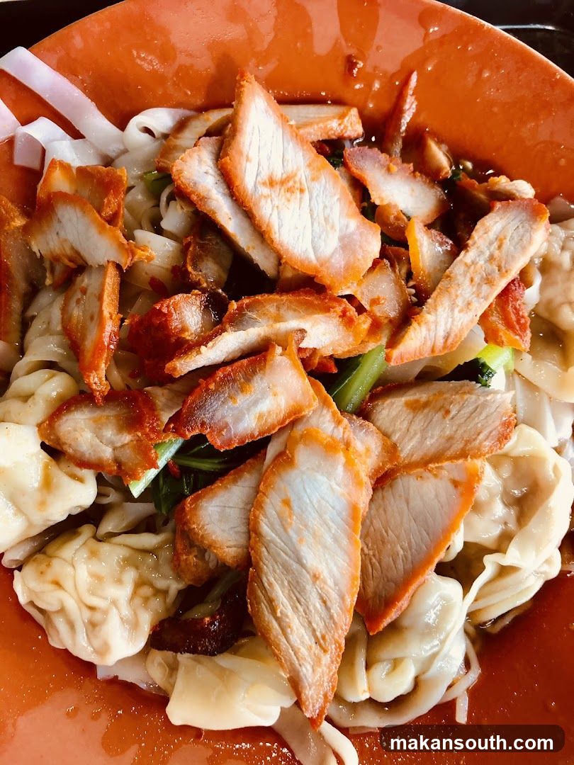 Bowl of noodles with crispy pork slices