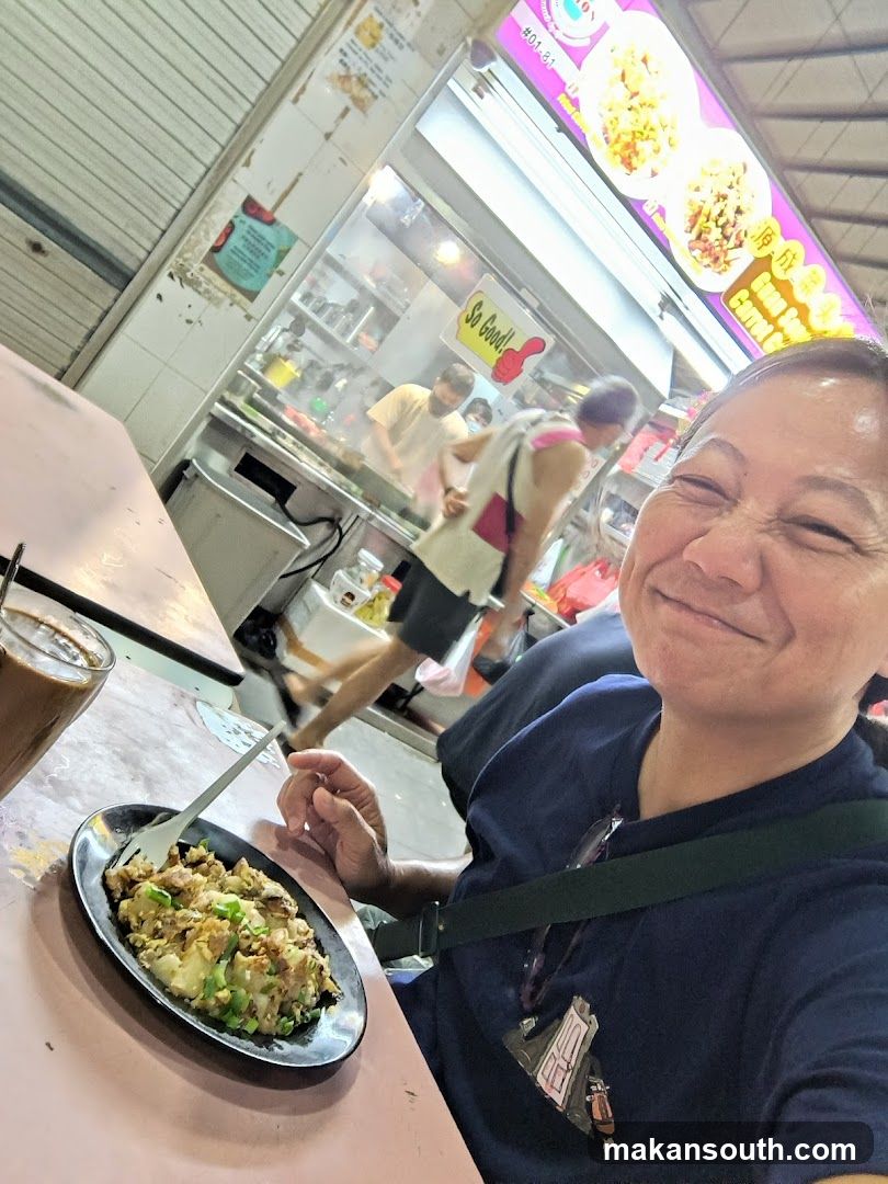 Food stall selfie with meal