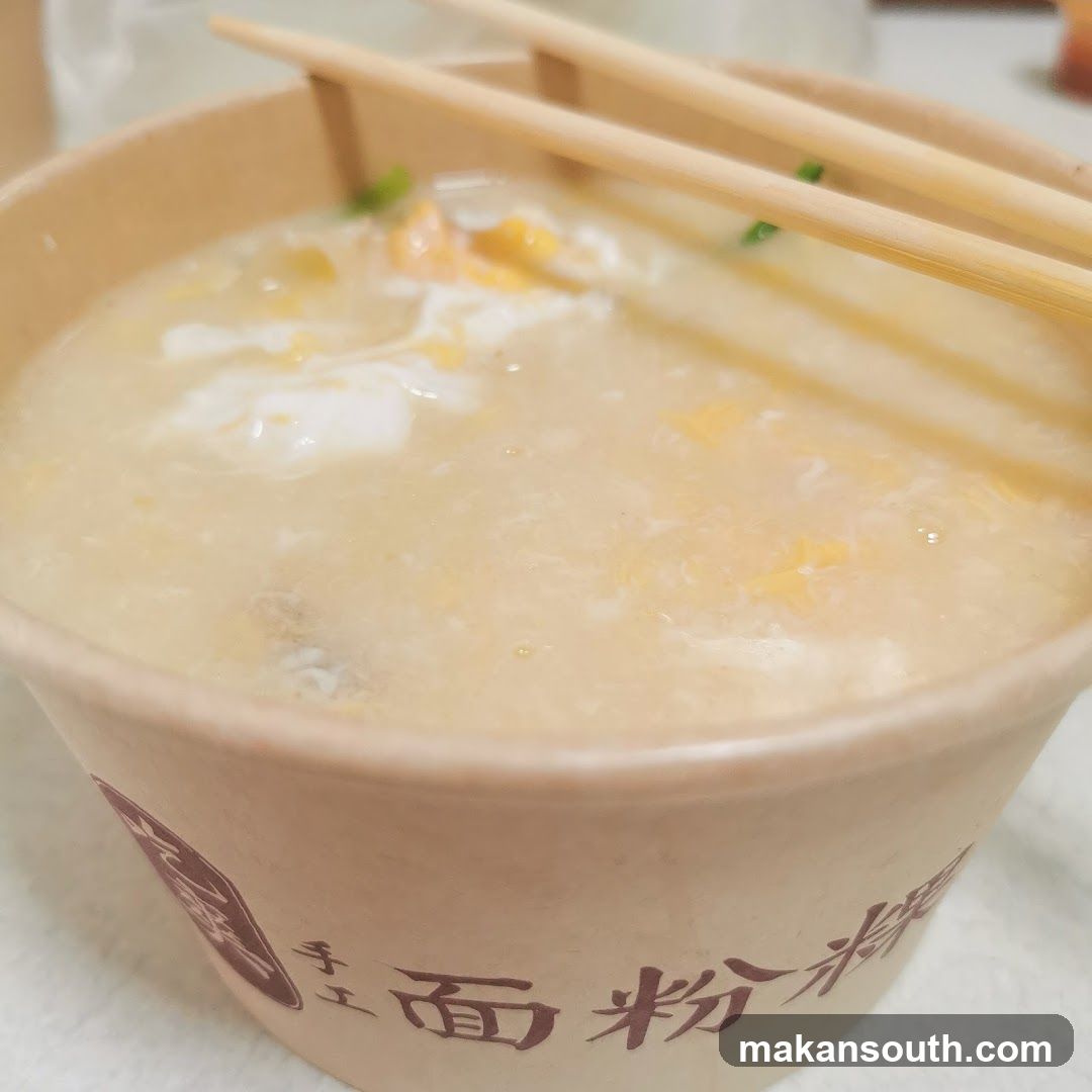 Bowl of congee with chopsticks