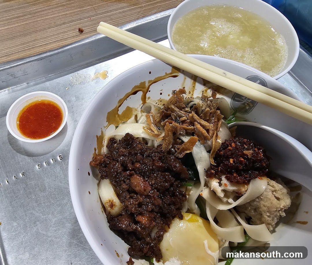 Noodle Bowl with Sauces and Chopsticks