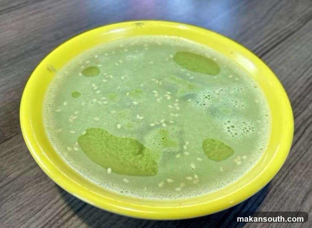 Green Soup in Yellow Bowl