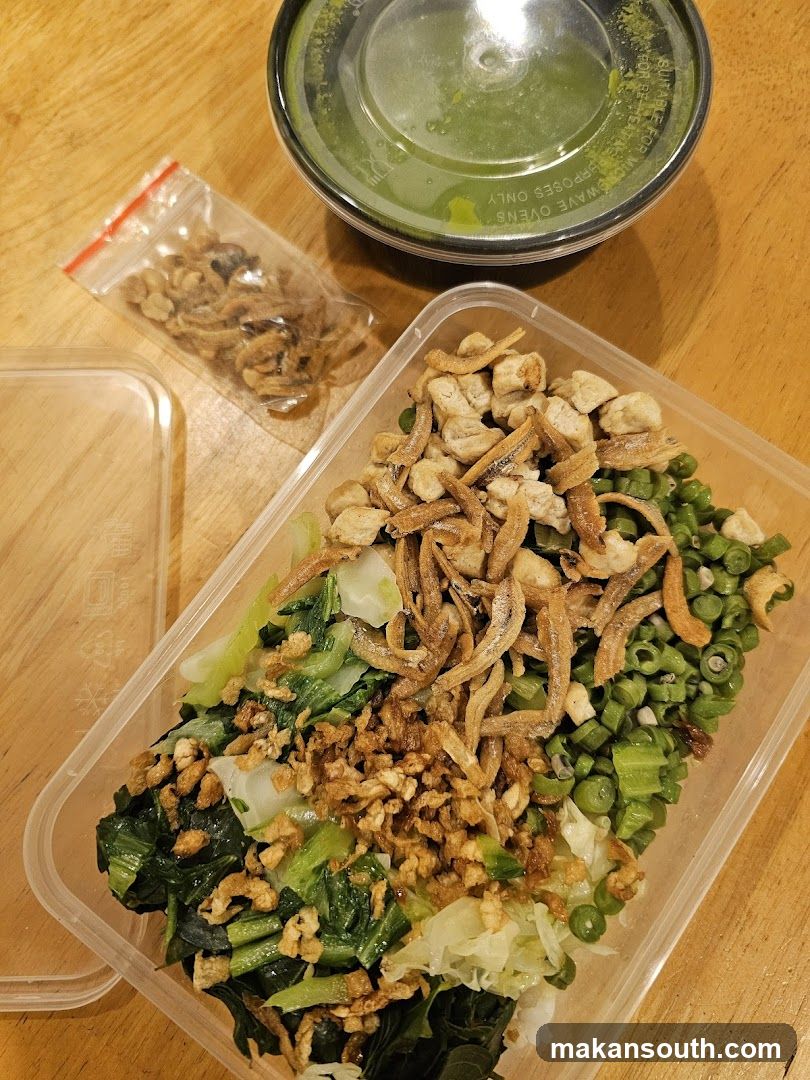 Takeout Meal Container with Side of Dried Fish