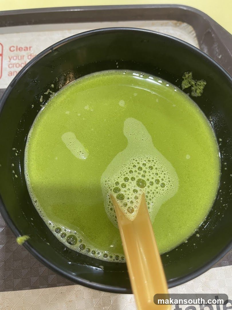 Green Soup with Spoon