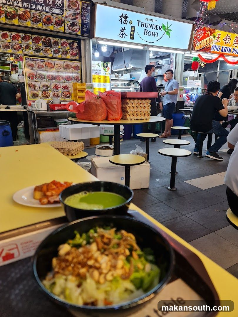 Food Court Scene with Meals and Background Stalls