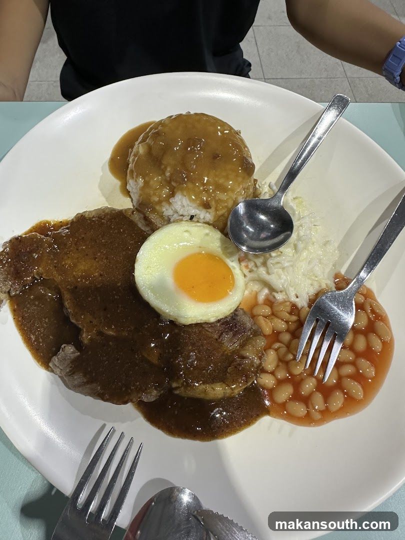 Plate of Curry Rice with Fried Egg and Baked Beans
