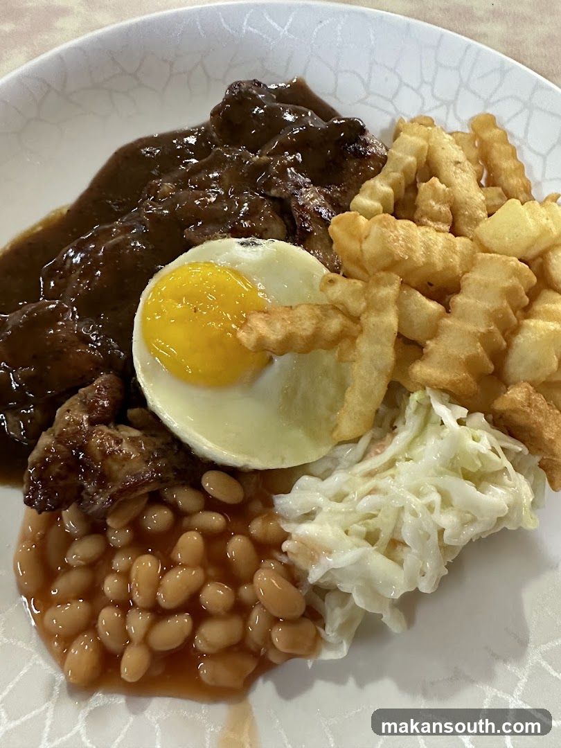 Plate of Food with Steak, Fries, Egg, Beans and Coleslaw